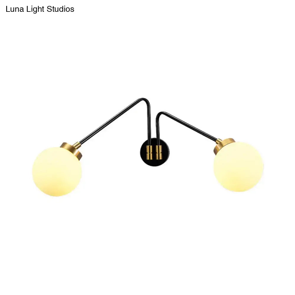 Mid century black and brass double-arm wall sconce with frosted opal glass globe shades for e26 e27 bulbs in bedroom