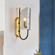 Gold-toned wall mount lamp with curved black metal arm and smoke grey glass shade for hall wall lighting