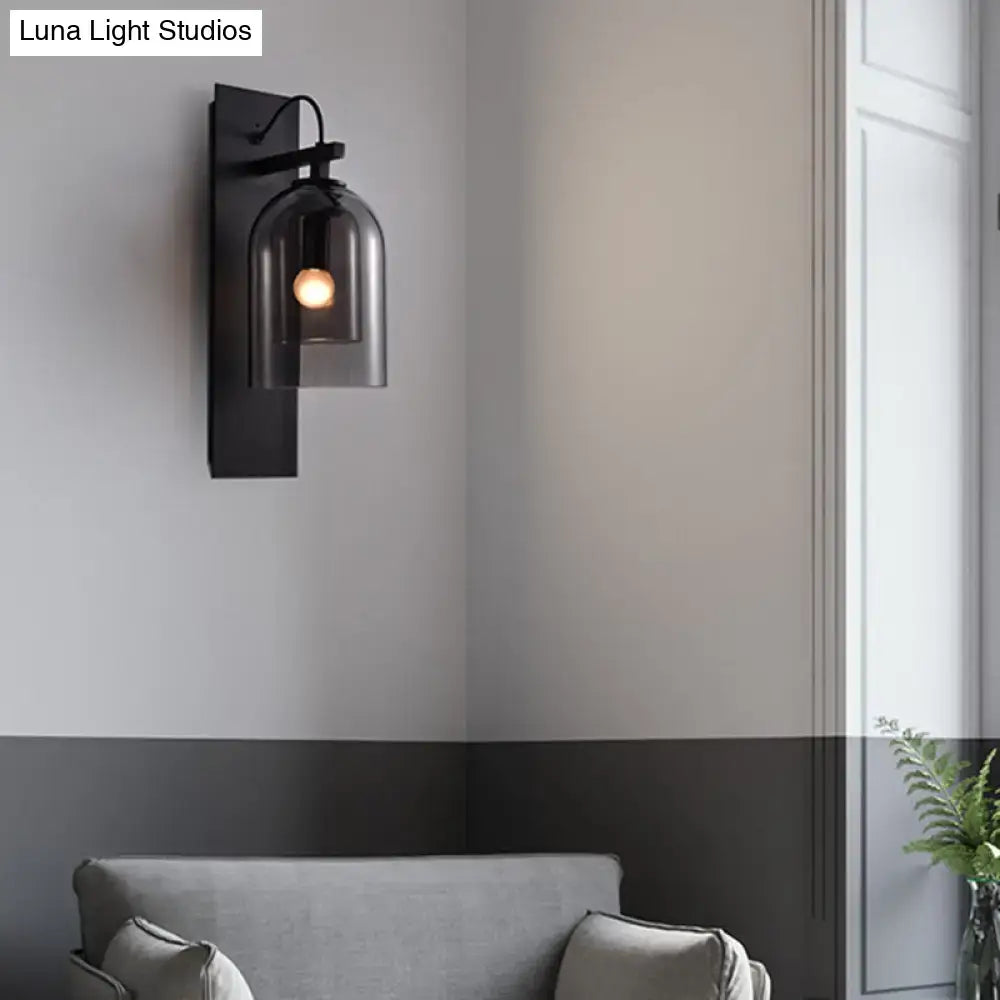 Mid-century black metal wall sconce with smoked glass dome shade for living room lighting, 8 inches wide