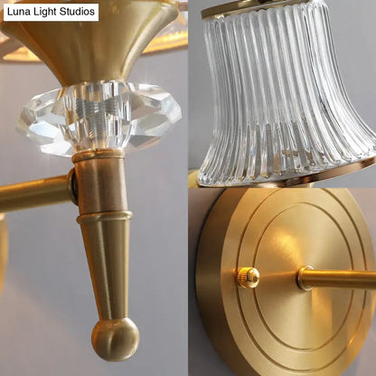 Mid-century brass crystal ribbed wall mounted lamp with faceted crystal accent and fluted glass shade for living room