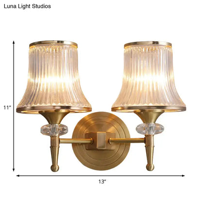 Mid-century brass crystal ribbed wall mounted lamp with fluted translucent glass shades and crystal accents for living room