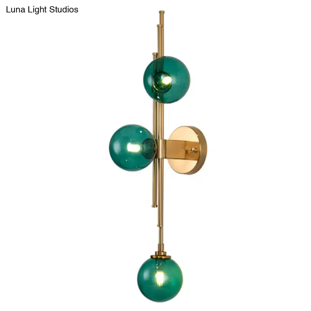 Modern mid century brass finish 3 light wall sconce with clear green glass orbs for living room lighting type