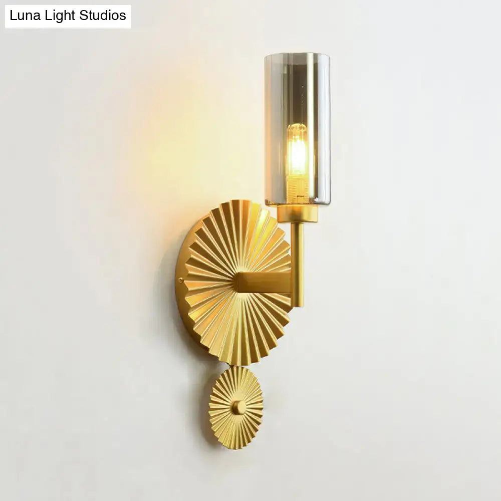 Mid century brass wall sconce with scalloped backplate gold-toned fan base and amber glass wall lamp for bedroom