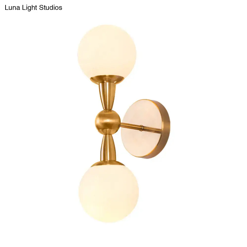 Mid century brass wall mount light with two frosted opal glass globe shades suitable for 220v-240v 110v-120v use