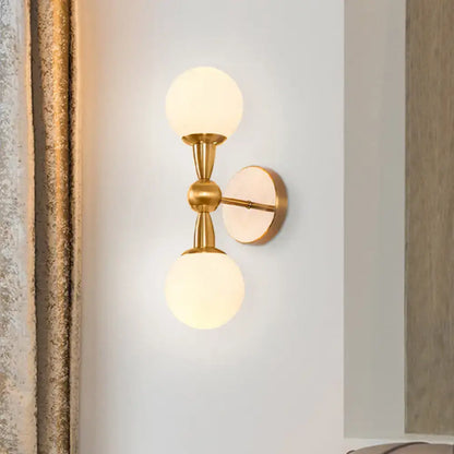 Mid century wall mount light in gold-toned brass with two frosted opal glass globes for bedroom use 220v-240v 110v-120v