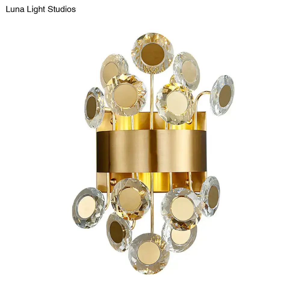 Mid century gold wall light with integrated led and crystal disc accents for living room illumination