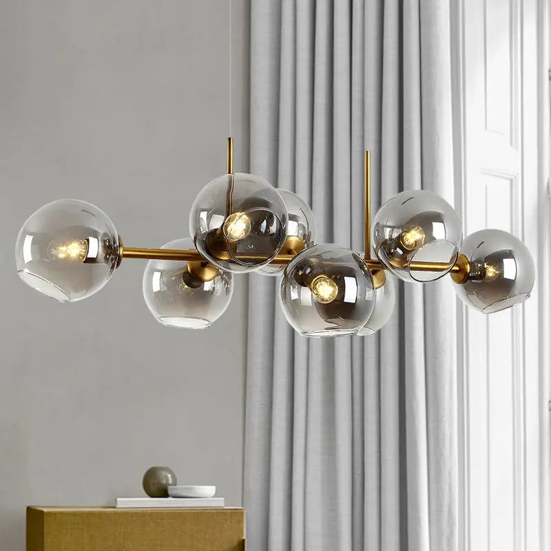 Modern mid-century gold metal chandelier with multiple smoked glass globe shades for dining room 110v-120v led lighting