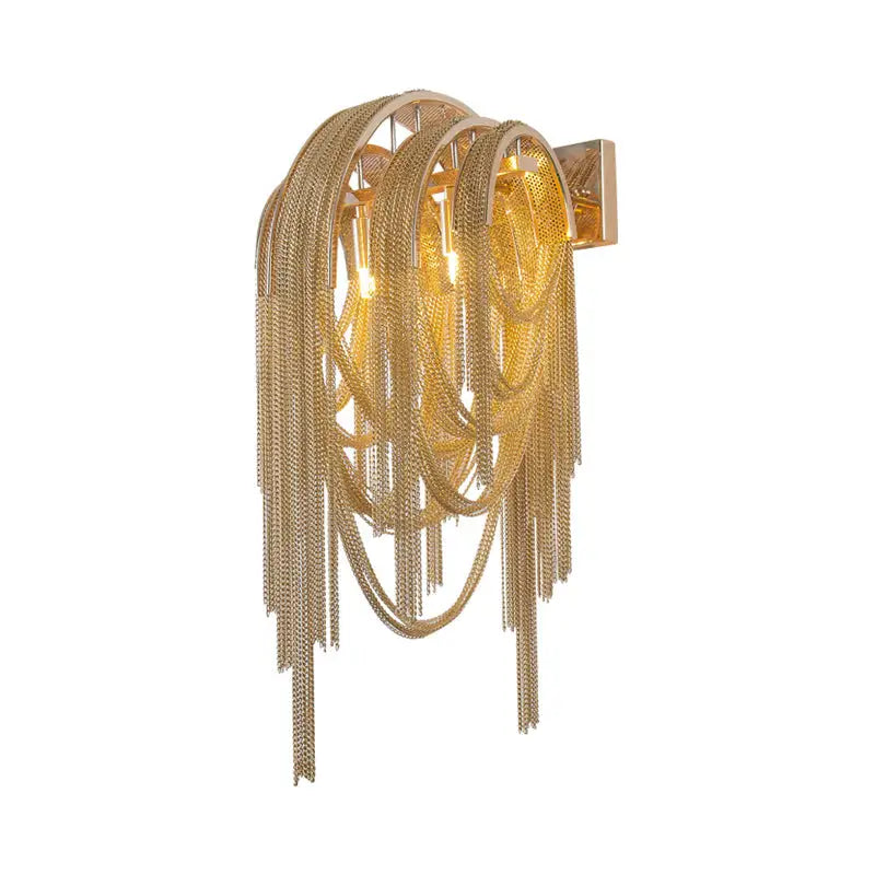 Gold-toned mid century wall lamp with silver stacked tassel design and sleek rectangular backplate for bedroom use