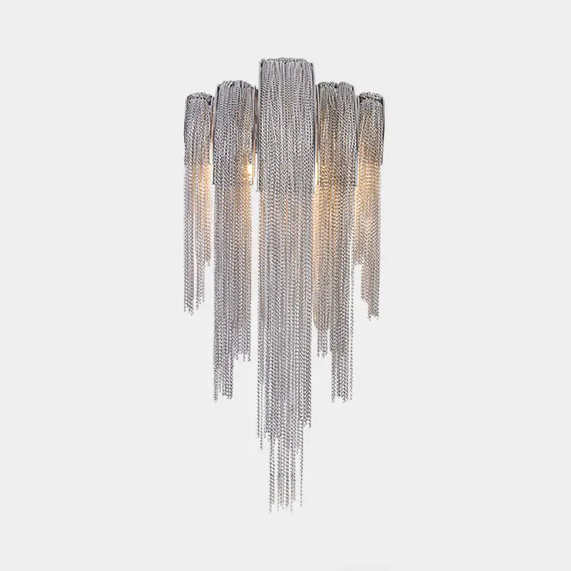 Silver chain wall lamp with cascading metallic strands featuring a gold silver stacked tassel design for bedroom use