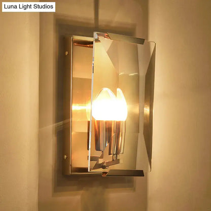 Mid century wall sconce with brushed brass frame crystal shield and warm bulb base for living room lighting