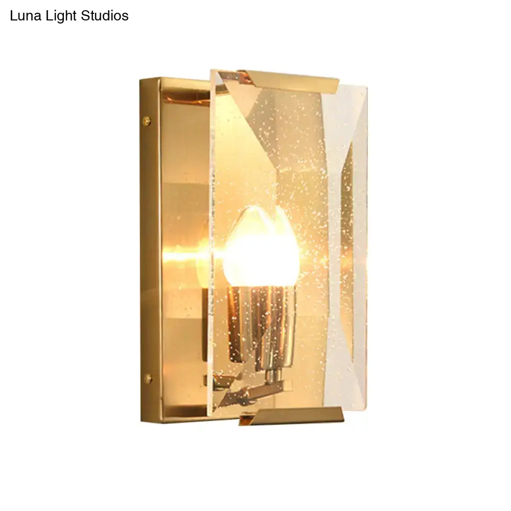 Mid century gold wall sconce with textured translucent glass panel and bulb base for elegant living room lighting