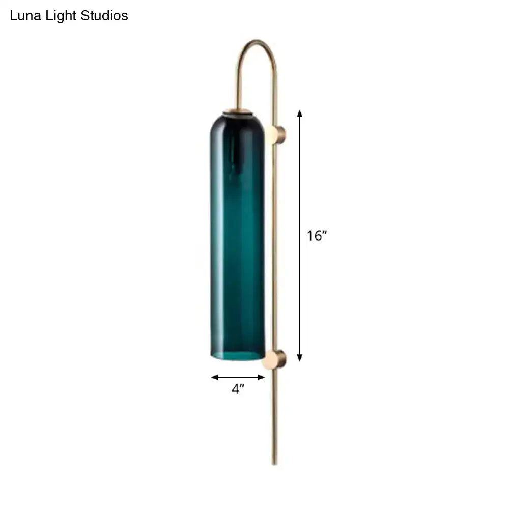 Mid century gooseneck wall light with polished brass hardware and deep teal cylindrical glass shade for bedroom use