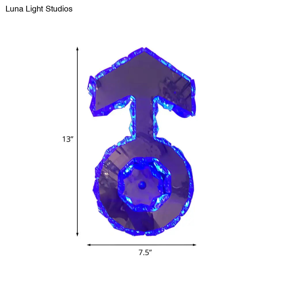 Minimal chrome faceted crystal boy logo wall lighting in translucent blue shaped like a male gender symbol