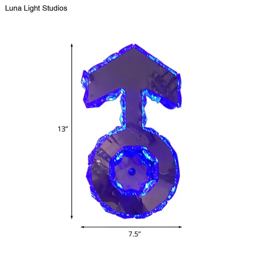 Minimal chrome faceted crystal boy logo wall lighting in translucent blue shaped like a male gender symbol
