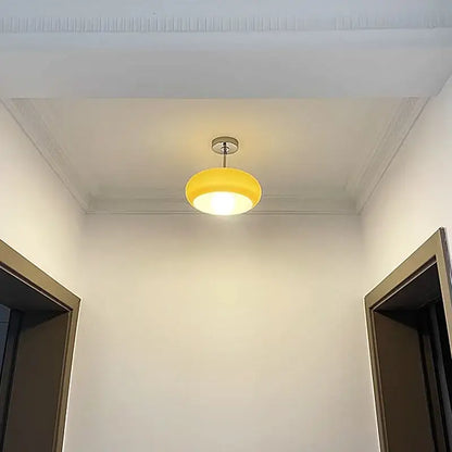 Minimalist amber glass copper led ceiling light with a modern yellow circular pendant design for hallway use