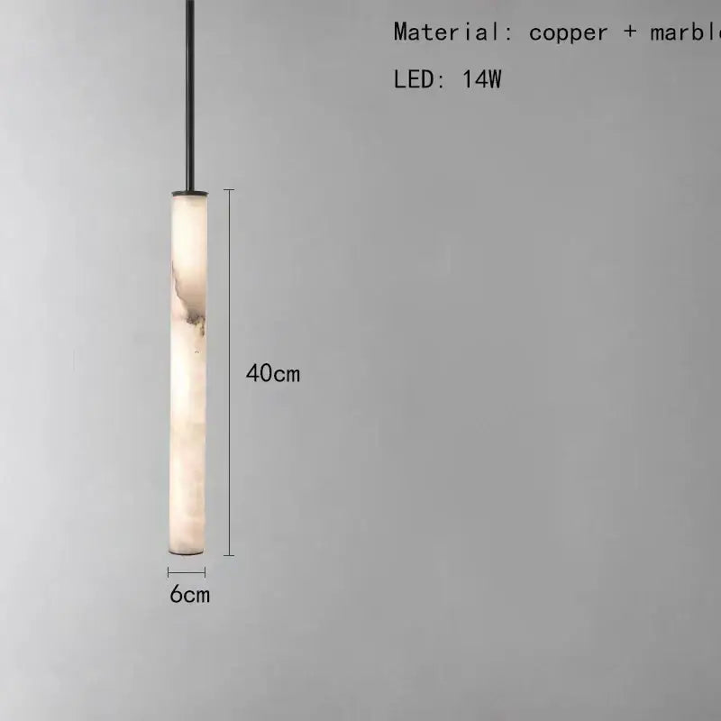 A sleek 40cm tall minimalist amber marble and black pendant light with polished copper finish for lighting areas