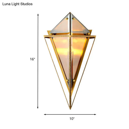 Minimalist gold-toned diamond wall light with clear amber and smoke gray glass panels for living room sconce