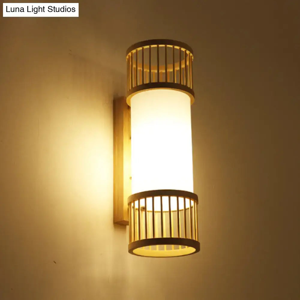Minimalist warm-toned bamboo cylinder shade wall sconce with frosted glass diffuser for stairway wall lamp