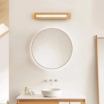 Minimalist round mirror with thin metallic frame paired with nordic style bamboo led wall sconce for bedroom lighting