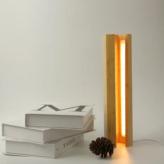 Minimalist decorbites bamboo pentagonal led desk lamp with warm vertical light strip between slender bamboo slats for reading