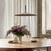 Beige minimalist cement ufo led pendant light with black suspension rod for dining room decorbites pendant lights
