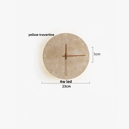 Circular wall clock with yellow travertine face and minimalist copper hands complements led wall lights design