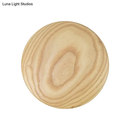 Minimalist beige wood circle led bulb wall sconce with round light-colored wooden knob and natural grain finish