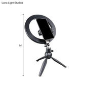 Black 14 inches fixture ring light with flash lighting mounted on tripod with phone holder for bedroom use
