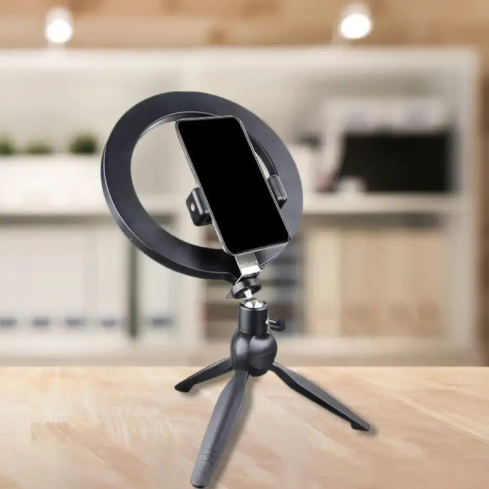 Minimalist black 14 inches fixture ring light with flash lighting mounted on tripod with phone holder for bedroom use