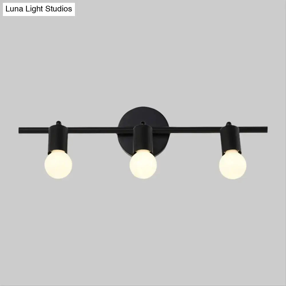Minimalist black 3-arm vanity light fixture with exposed bulbs designed as a bathroom vanity light fixture