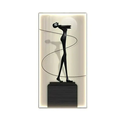 Minimalist black abstract figure luminous wall lamp with elongated limbs on a dark base for living room decor