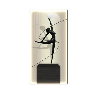 Minimalist black abstract figure luminous wall lamp with glossy dancer figurine holding white sphere on wooden base