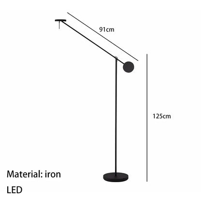 Black iron wall lamp with a minimalist design featuring an adjustable swing arm and spherical light head for bedroom use