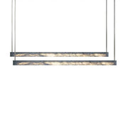 Minimalist black and amber marble design pendant light featuring sleek metal frames for modern office lighting