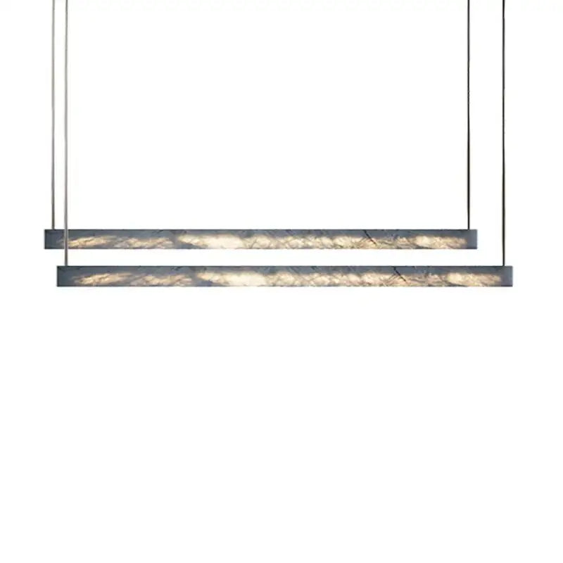 Minimalist black and amber marble design pendant light featuring sleek metal frames for modern office lighting