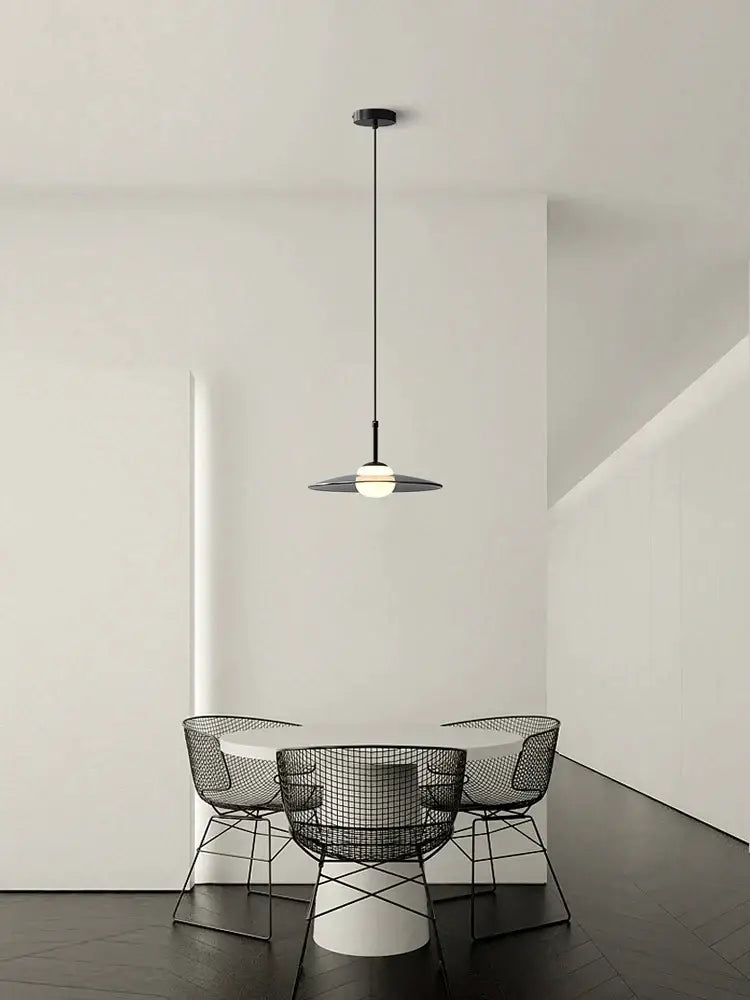 Black wireframe pendant light with a sleek, minimalist design and a frosted glass globe.