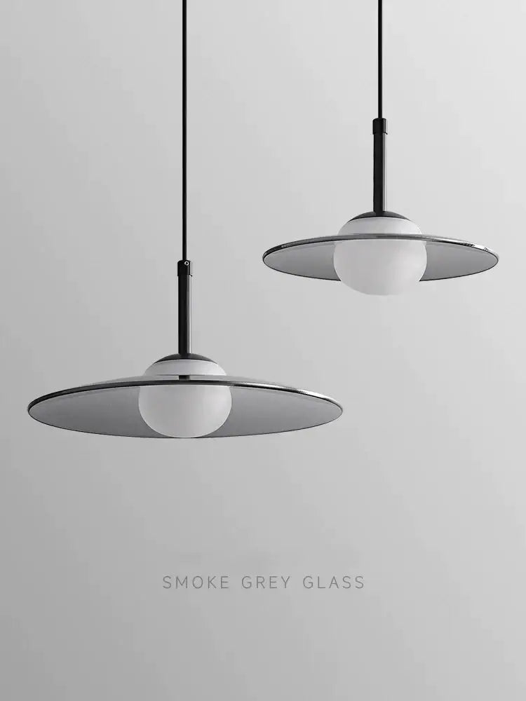 Minimalist black and copper decorbites glass pendant lamp with sleek smoke grey glass shades for bedroom light decor