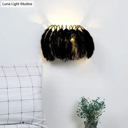 Minimalist black ostrich feather wall sconce with gold metal frame light type and fixture height designed for bedroom use