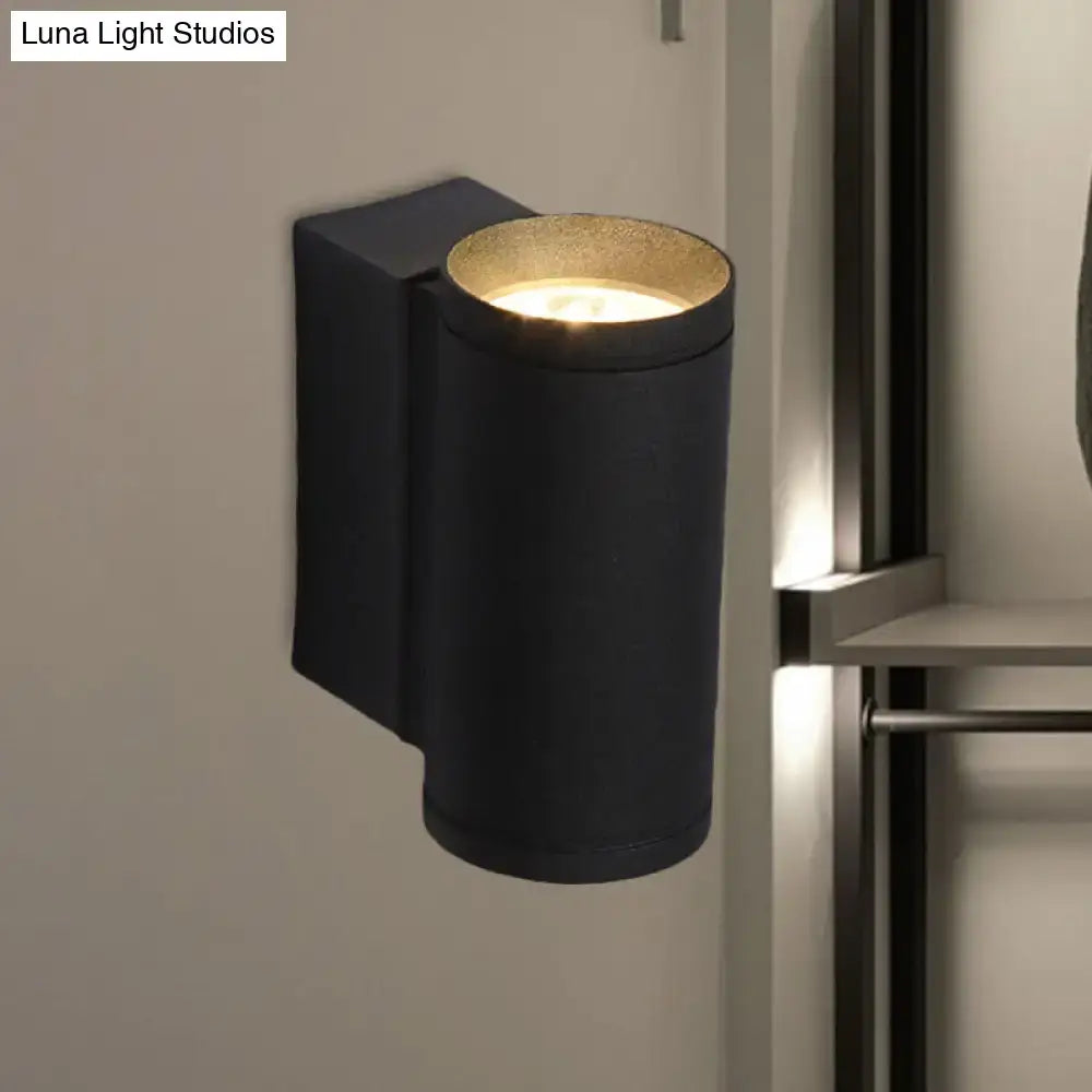 Minimalist black and gold metal wall mounted lamp with cylindrical shape and gold-finished interior wall lamp for bedroom