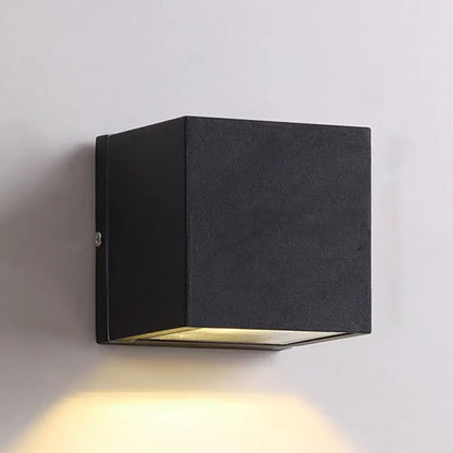 Minimalist black matte and brass led flush mount wall sconce with warm downward light for corridor lighting