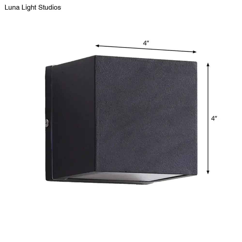 Minimalist black and brass led flush mount wall sconce with a textured 4-inch cube design for outdoor corridor lighting