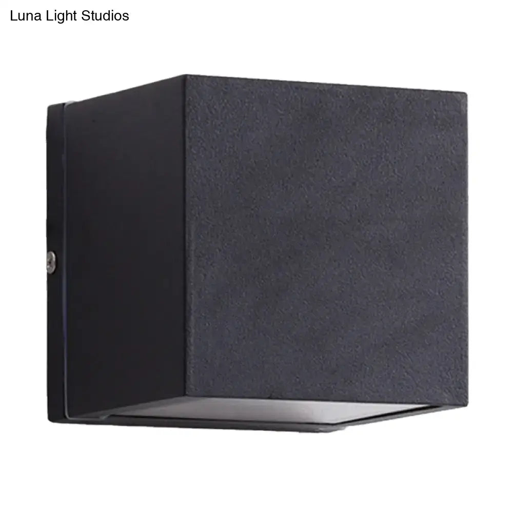 Black textured cube-shaped led flush mount wall sconce with brass accents for minimalist outdoor corridor lighting