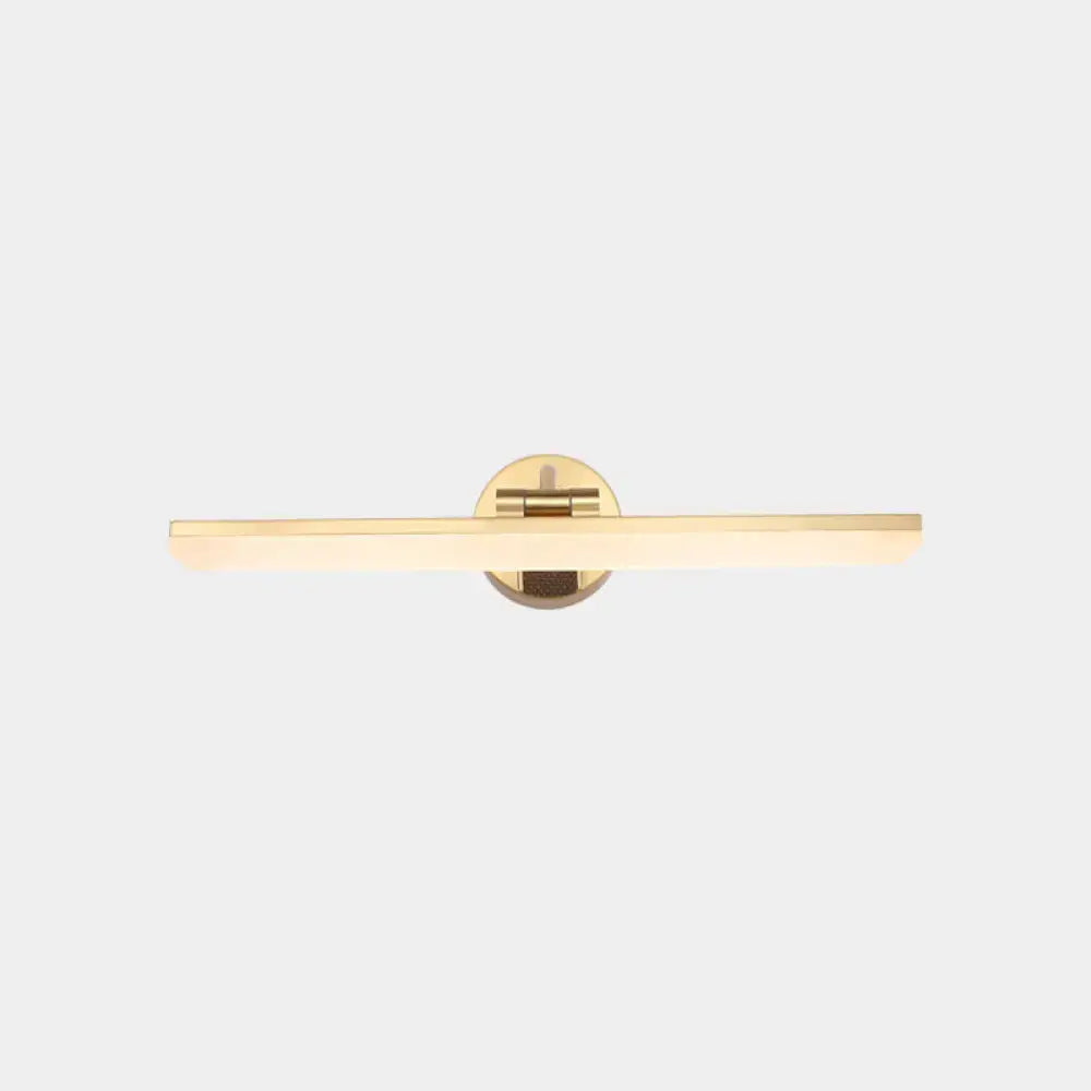 Gold-toned minimalist wall mounted vanity light with a rectangular light bar and circular brass mounting plate for bathrooms