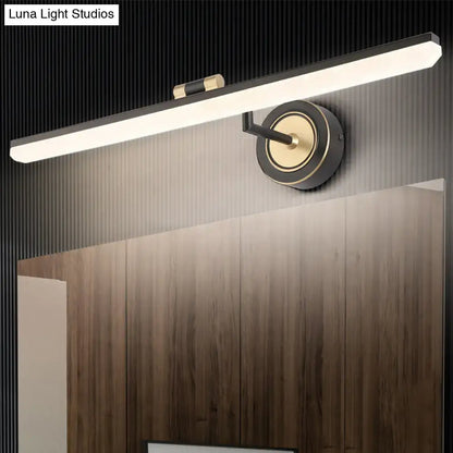 Minimalist black and brass wall mounted vanity light with sleek rectangular design and adjustable spotlight for targeted illumination