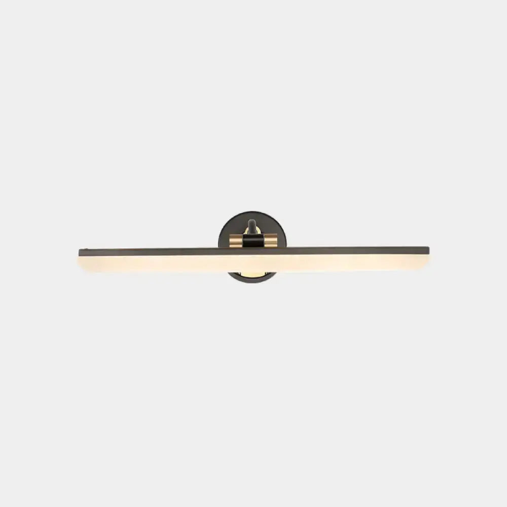 Minimalist black and brass wall mounted vanity light with a sleek finish and warm diffused illumination for bathroom