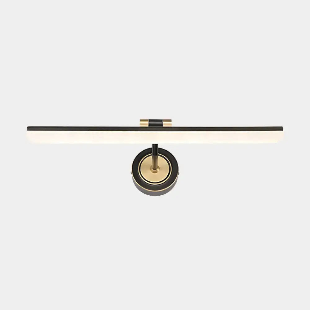 Modern black and brass wall mounted vanity light with sleek rectangular design for minimalist bathroom use