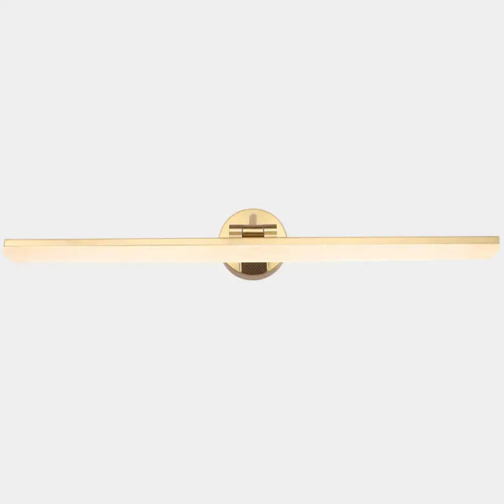 Gold-toned minimalist wall mounted vanity light with a sleek rectangular light bar and circular mounting plate in brass