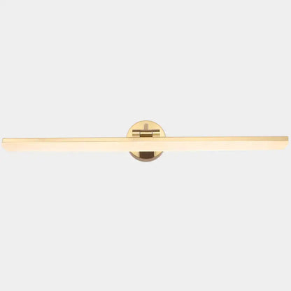 Gold-toned minimalist wall mounted vanity light with a sleek rectangular light bar and circular mounting plate in brass