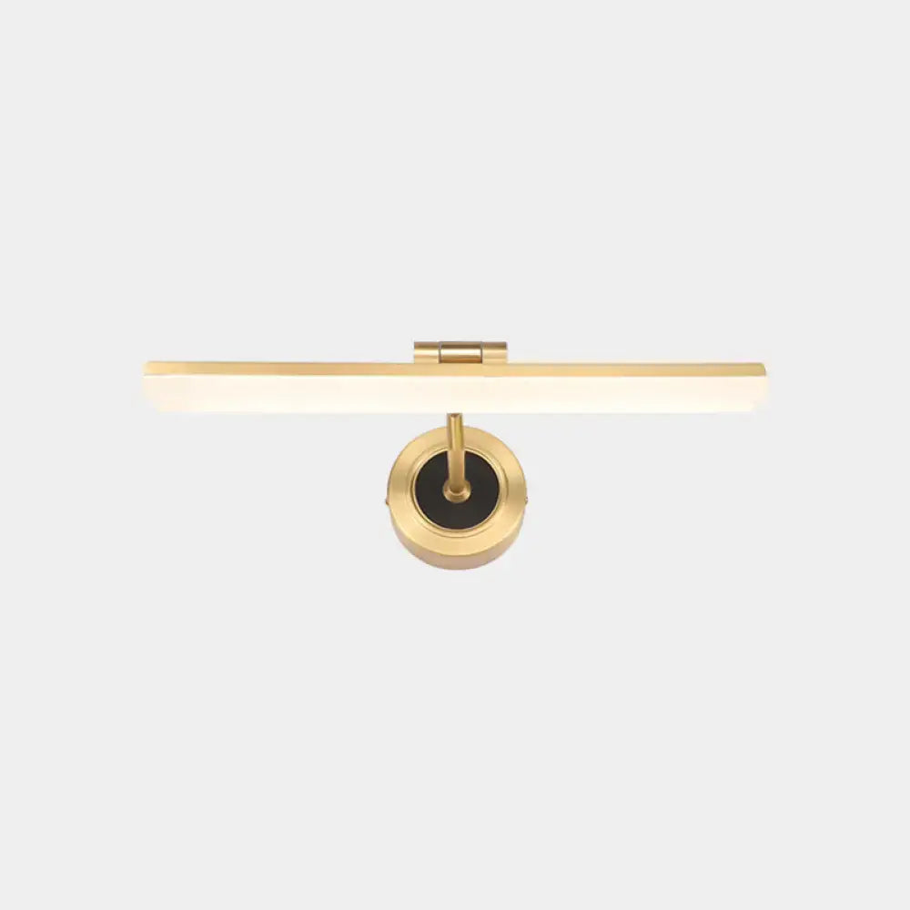 Gold-finished wall mounted vanity light with sleek rectangular illuminated bar and circular brass base for bathroom use