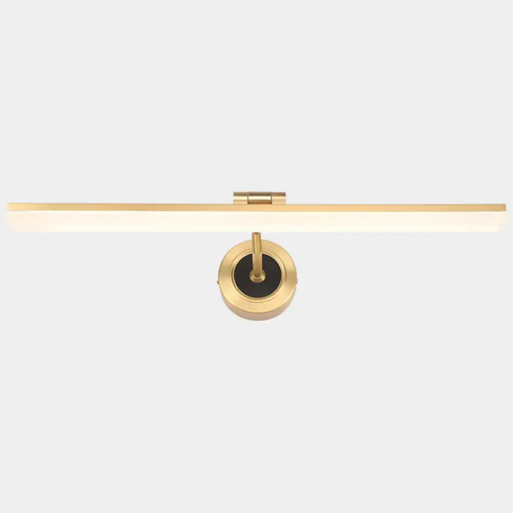 Gold-finished wall mounted vanity light with black rectangular shade and circular brass base for bathroom use
